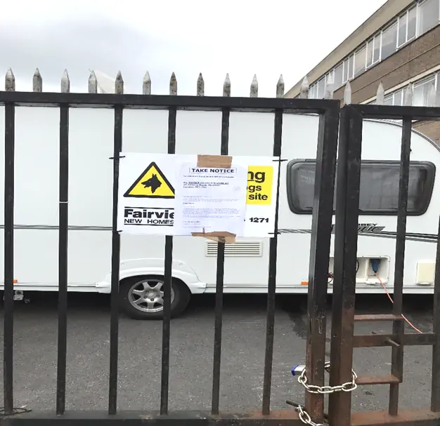 locked gates to entrance to yard