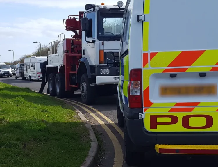 tow truck and police van